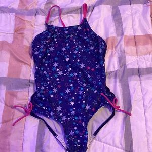 Dark blue bathing suit with stars on them